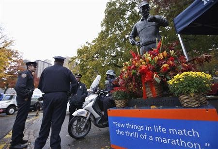 New York City Police (NYPD) officers stand guard near the finish line of the New York City Marathon in New York's Central Park November 1, 2013. REUTERS/Mike Segar