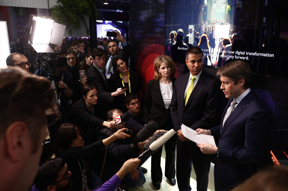 U.S. Deputy Assistant secretary for Cyber and International Communications and Information Policy Robert Strayer, right, and Ajit Pai, Chairman of the Federal Communications Commission, centre, attend a press conference at the Mobile World Congress wireless show, in Barcelona, Spain, Tuesday, Feb. 26, 2019. The annual Mobile World Congress (MWC) runs from 25-28 February in Barcelona, where companies from all over the world gather to share new products. (AP Photo/Manu Fernandez)