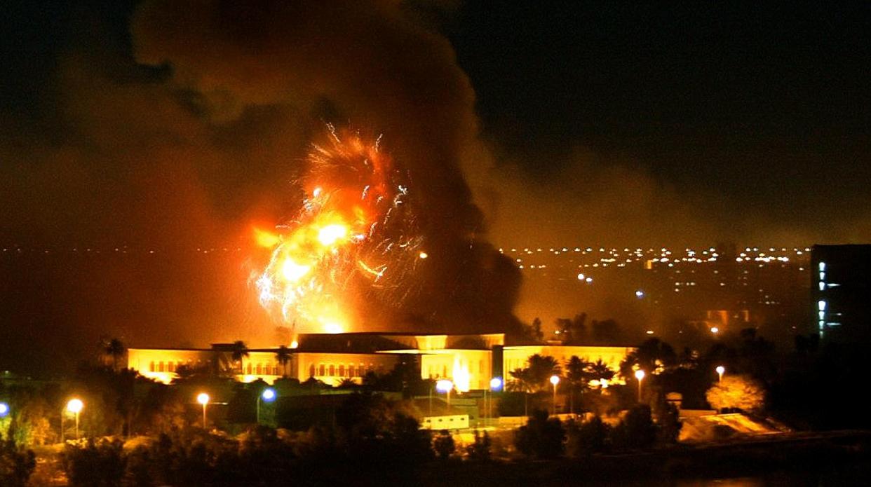 Smoke covers the presidential palace compound in Baghdad on  March 21, 2003 during a massive US-led air raid on the Iraqi capital. Smoke billowed from a number of targeted sites, including one of President Saddam Hussein's palaces, an AFP correspondent said.