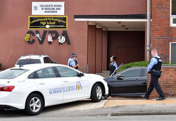 PHOTO: St. Louis metropolitan police officers stand outside an entrance at the northeast corner of the Central Visual and Performing Arts High School after a shooting that left three people dead including the shooter, Oct. 24, 2022, in St. Louis. (Tim Vizer/AFP via Getty Images)