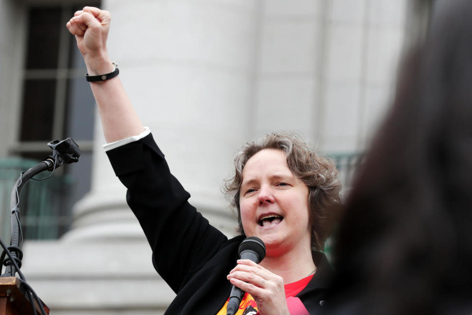 Madison Mayor Satya Rhodes-Conway raises her fist as she speaks to a crowd (Steve Apps / Wisconsin State Journal via AP file)