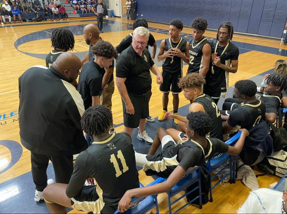 Gateway boys basketball coach Grady Lee talks to his team during a timeout in Friday night’s Class 4A-Region 3 final at St. Petersburg Gibbs. The visiting Eagles lost, 71-49, to end their season at 22-4.