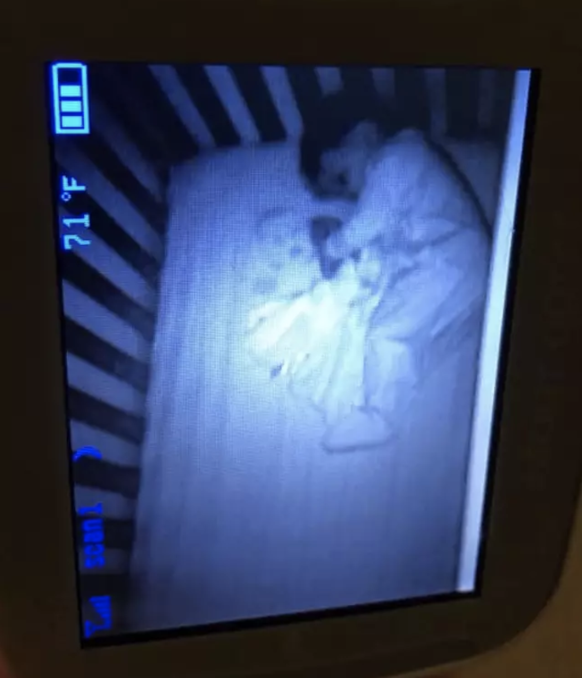 A mother was left after a ghost-like figure was spotted in her baby's cot. Photo: Facebook