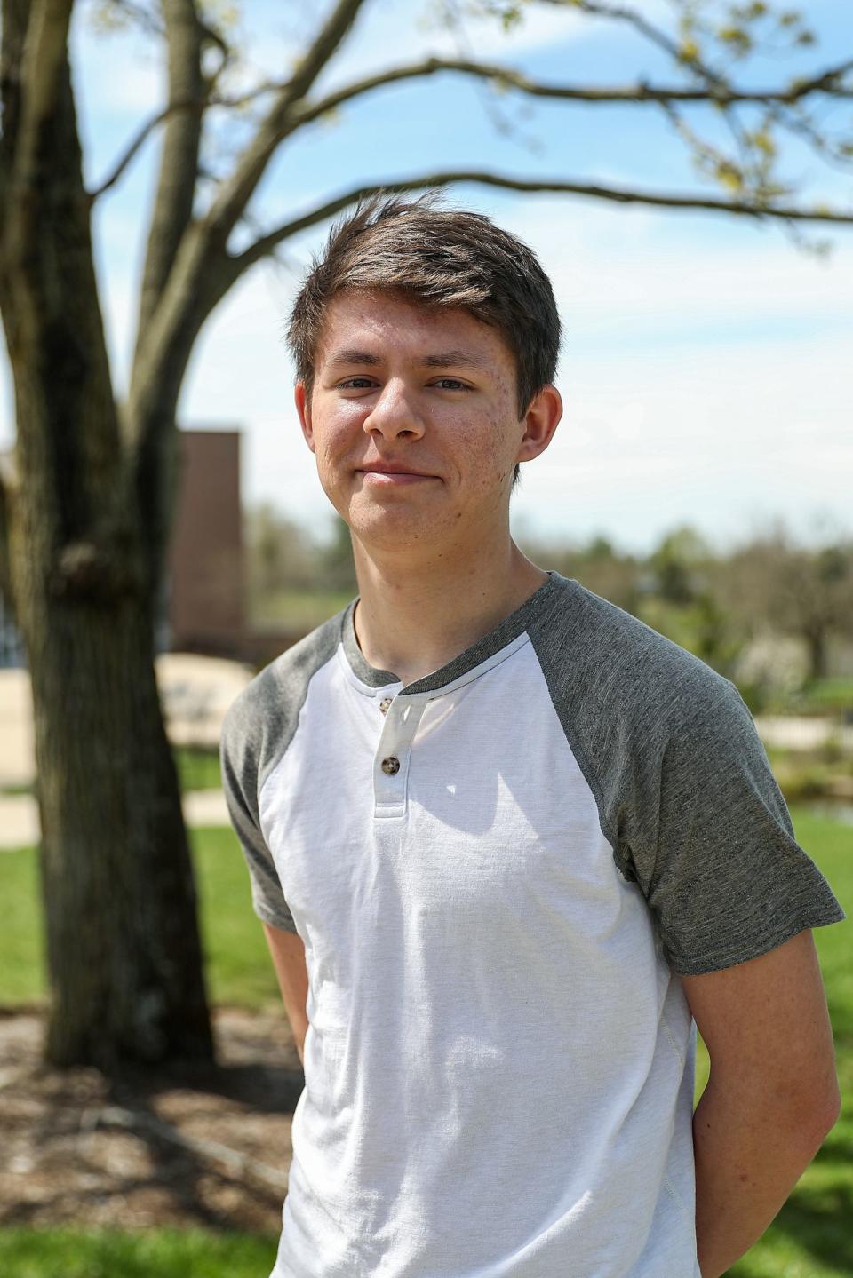 David Chinn, a freshman at Taylor University in Upland, Ind., poses for a picture on campus, Monday, April 22, 2019. Since the announcement that Vice President Mike Pence will speak at commencement in May, students, faculty,  alumni and surrounding residents have publicly responded with  strong mixed opinions. "Even just between people that don't really take a side on this issue, they're really disheartened and upset by how much conflict and division is on campus," Chinn said.