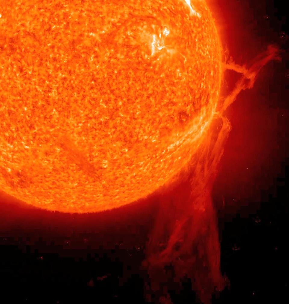 A very long solar filament that had been snaking around the Sun erupted (Dec. 6, 2010) with a flourish. STEREO (Behind) caught the action in dramatic detail in extreme ultraviolet light of Helium. It had been almost a million km long (about half a solar radius) and a prominent feature on the Sun visible over two weeks earlier before it rotated out of view. Filaments, elongated clouds of cooler gases suspended above the Sun by magnetic forces, are rather unstable and often break away from the Sun. <em>Credit: NASA/GSFC/SOHO NASA</em>