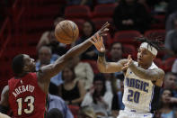 Orlando Magic guard Markelle Fultz (20) passes past Miami Heat forward Bam Adebayo (13) during the first half of an NBA basketball game Wednesday, March 4, 2020, in Miami. (AP Photo/Wilfredo Lee)