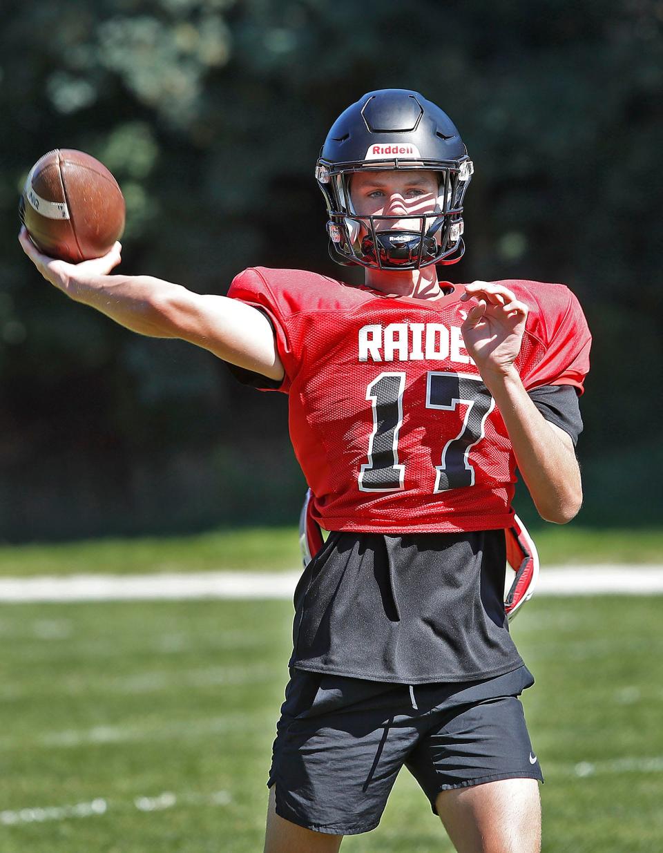 Quarterback hopeful junior Mike Galligan throws some passes n practice.The North Quincy Raiders football team practice for their first scrimmage on Saturday against S.Mary's of Lynn on Wednesday, August 23, 2023  
