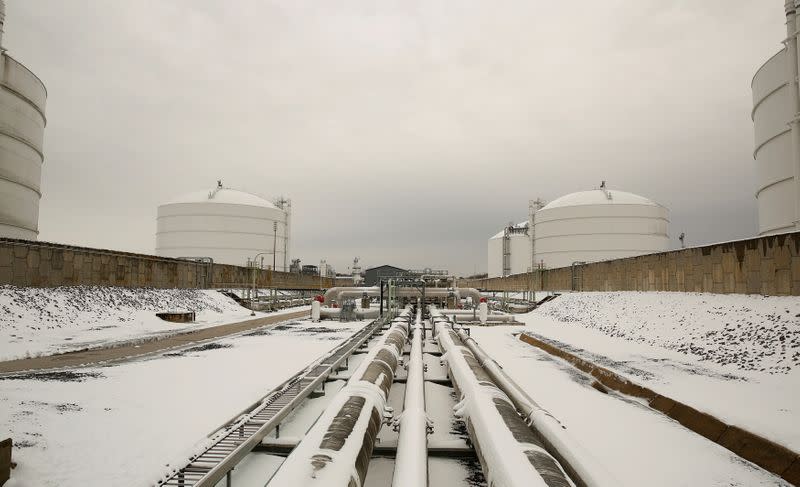 FILE PHOTO: Snow covered transfer lines leading to storage tanks at the Dominion Cove Point Liquefied Natural Gas (LNG) terminal in Lusby, Maryland