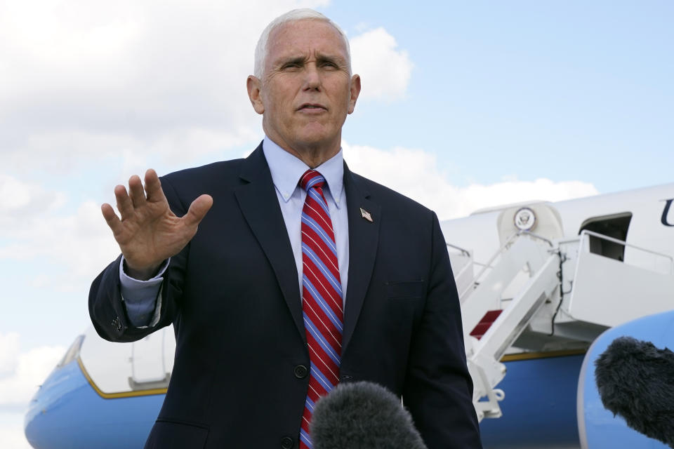 Vice President Mike Pence speaks to members of the media at Andrews Air Force Base, Md., Monday, Oct. 5, 2020, as he leaves Washington for Utah ahead of the vice presidential debate schedule for Oct. 7. (AP Photo/Jacquelyn Martin)