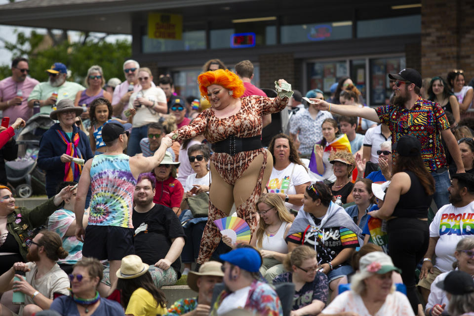 Miss Moscato is seen preforming during a drag show at the Lynne Sherwood Waterfront Stadium in Grand Haven, Mich., on Saturday, June 10, 2023. The festival — which organizers had hoped would attract at least 500 attendees — drew thousands of people from all over who came to experience the first-time event's drag show, dance party and vendor-filled streets. (AP Photo/Kristen Norman)