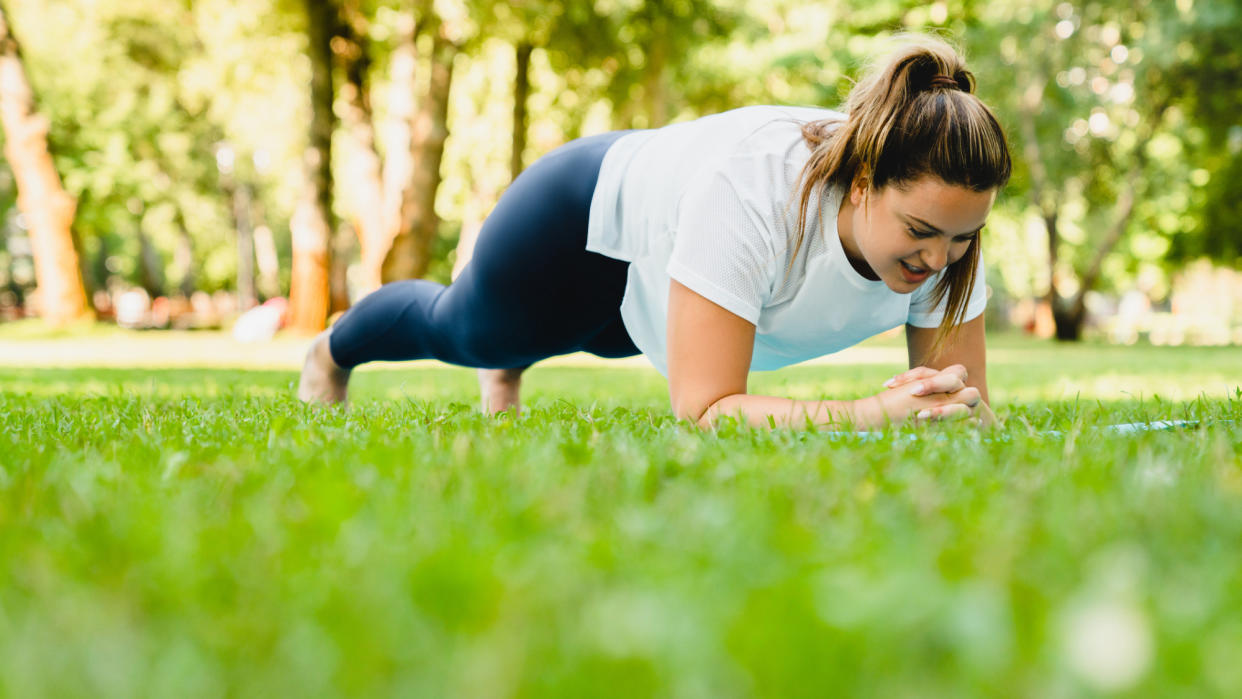  A woman doing a plank. 