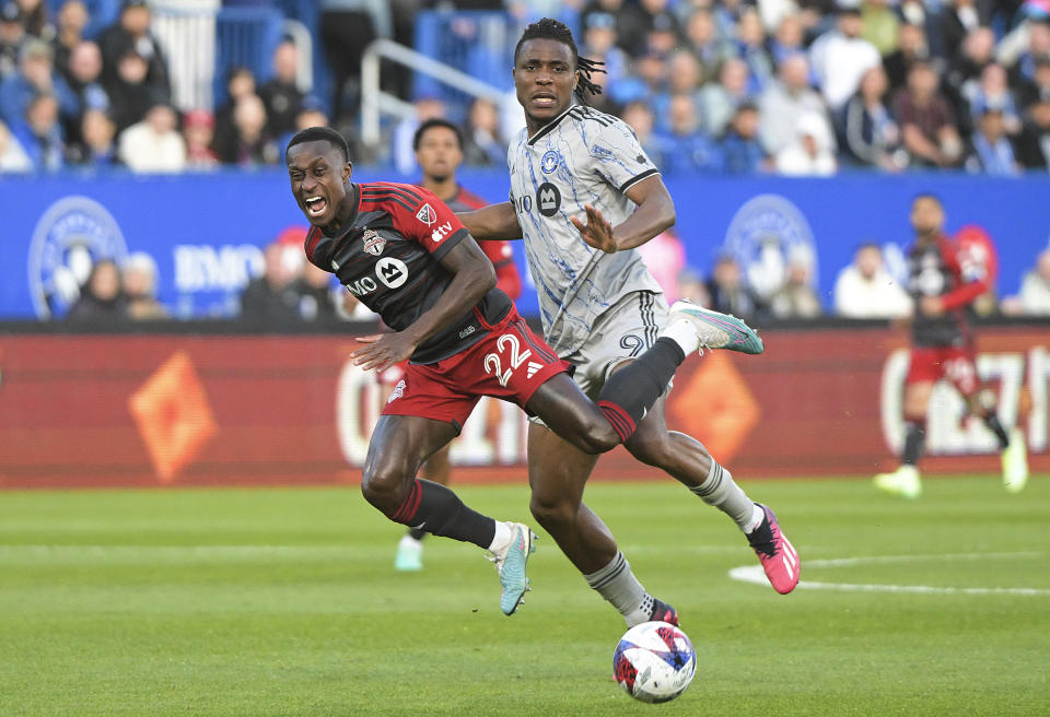CF Montreal's Chinonso Offor, right, defends against Toronto FC's Richie Laryea during the first half of an MLS soccer match Saturday, May 13, 2023, in Montreal. (Graham Hughes/The Canadian Press via AP)