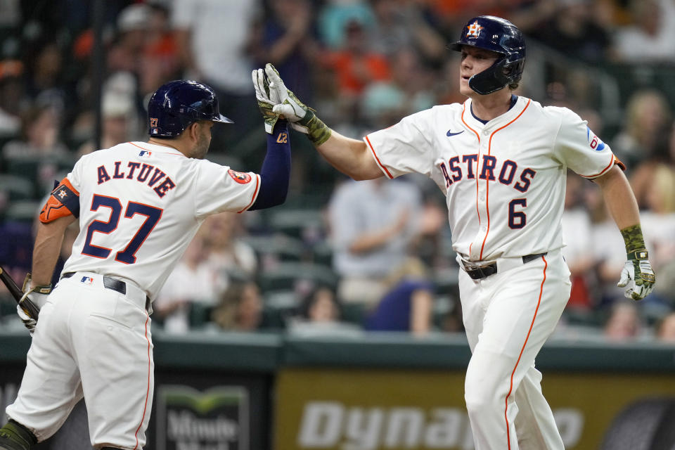 Houston Astros' Jake Meyers (6) celebrates his solo home run against the Milwaukee Brewers with Jose Altuve during the fifth inning of a baseball game Saturday, May 18, 2024, in Houston. (AP Photo/Eric Christian Smith)