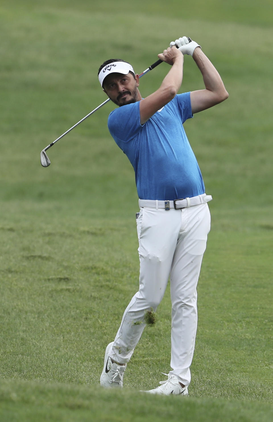 Mike Lorenzo-Vera of France follows his ball on the first hole during the first round of the DP World Tour Championship golf tournament in Dubai, United Arab Emirates, Thursday, Nov. 21, 2019. (AP Photo/Kamran Jebreili)