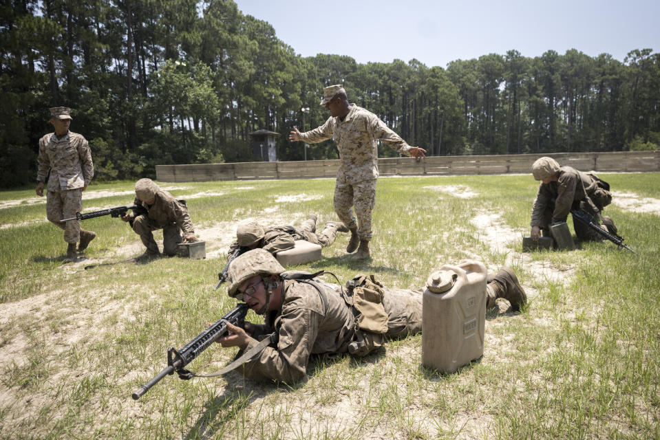 Drill instructor Sgt. Ramon Bruno, center, trains recruits during a portion of training known as the Crucible at the Marine Corps Recruit Depot, Thursday, June 29, 2023, in Parris Island, S.C. (AP Photo/Stephen B. Morton)