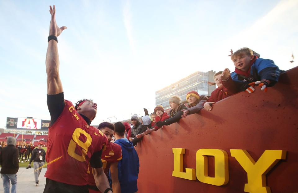 Iowa State receiver Xavier Hutchinson (8), a former Bartram Trail standout, celebrates with fans after a Nov. 5 victory over West Virginia.