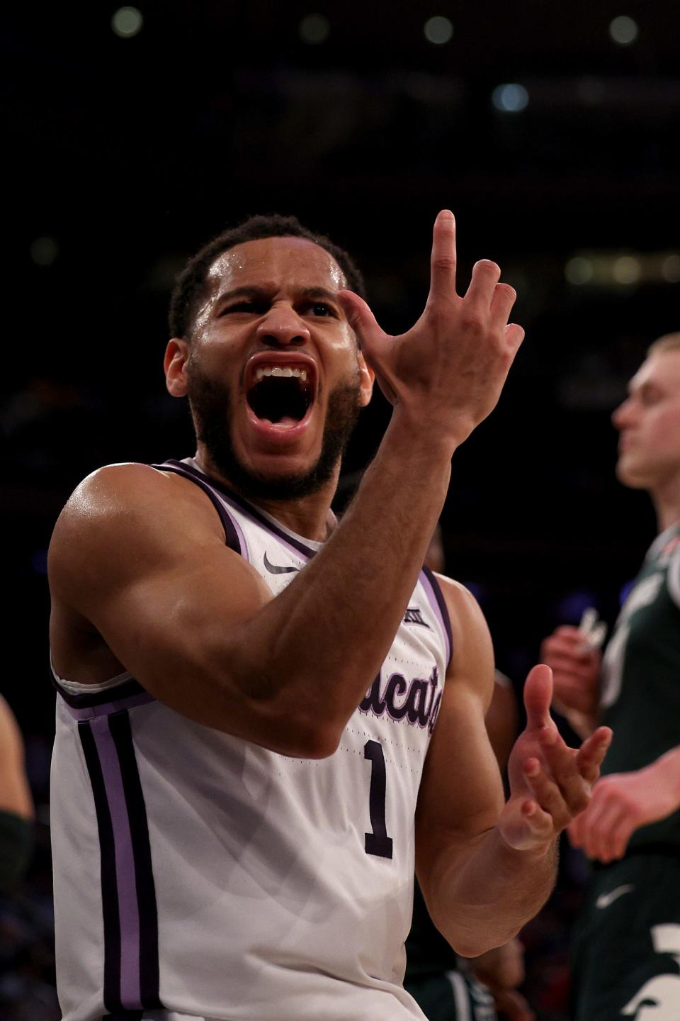 Markquis Nowell of the Kansas State Wildcats celebrates a basket against the Michigan State Spartans during the first half in the Sweet 16 round game of the NCAA Men's Basketball Tournament at Madison Square Garden in New York City.