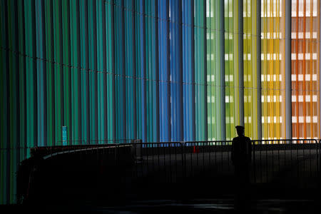 A security guard stands at the National Exhibition and Convention Center, the venue for the upcoming China International Import Expo (CIIE), in Shanghai, China November 3, 2018. REUTERS/Aly Song