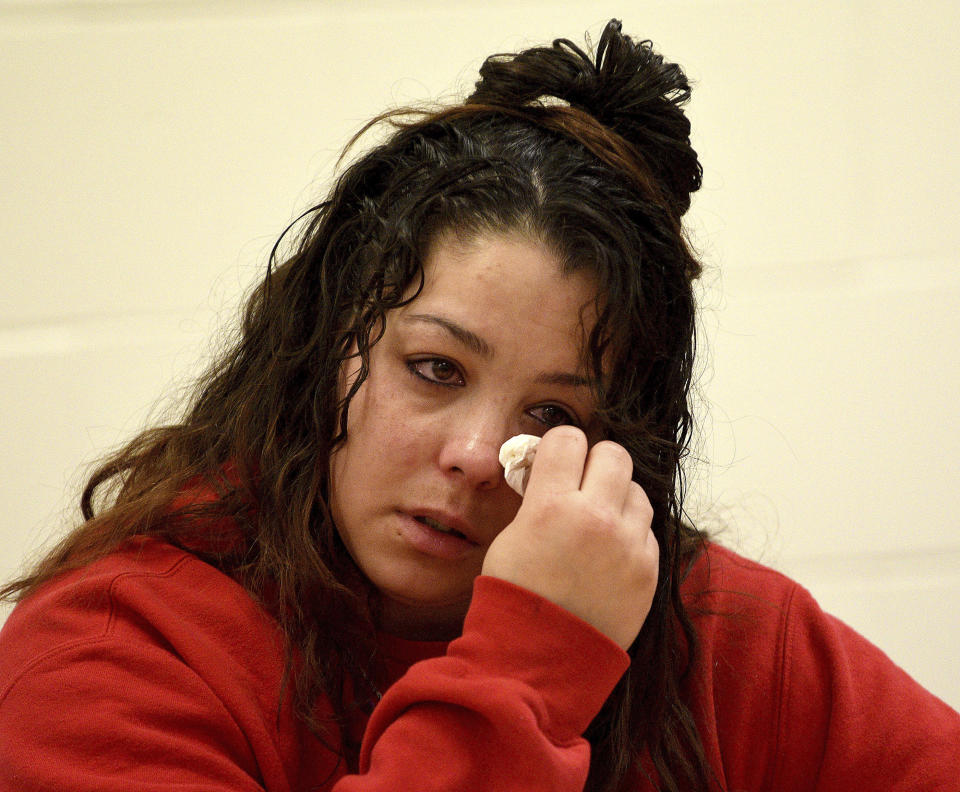 Kayla Montgomery wipes away tears during questioning from the parole board at the New Hampshire Correctional Facility for Women in Concord, N.H., on Thursday, March 7, 2024. Kayla Montgomery, the estranged wife of Adam Montgomery, convicted of killing his 5-year-old daughter and moving the body around for months, has been granted parole more than a year after she was sentenced to prison for lying about where she was when the child was last seen. (David Lane/Union Leader via AP, Pool)