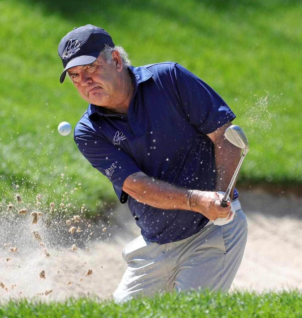 David Frost plays out of the bunker on the 3rd hole during first round of the Bridgestone Senior Players Tournament at Firestone Country Club on Thursday.