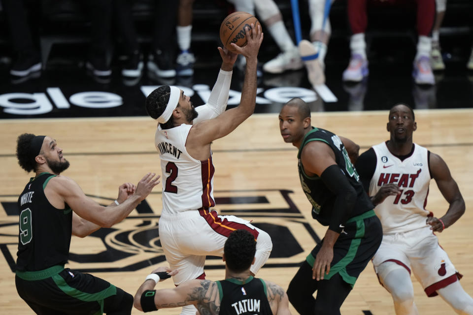 Miami Heat guard Gabe Vincent (2) drives to the basket during the second half of Game 3 of the NBA basketball playoffs Eastern Conference finals against the Boston Celtics, Sunday, May 21, 2023, in Miami. (AP Photo/Lynne Sladky)