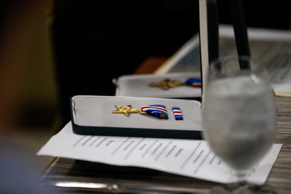 The Silver Star is returned to the Tyndall family after being missing for some time Tuesday, Aug. 16, 2022, at Seventy-Six Restaurant in Holland.