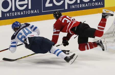 Ice Hockey - 2016 IIHF World Championship - Gold medal match - Finland v Canada - Moscow, Russia - 22/5/16 - Boone Jenner of Canada in action with Mikael Granlund of Finland. REUTERS/Grigory Dukor