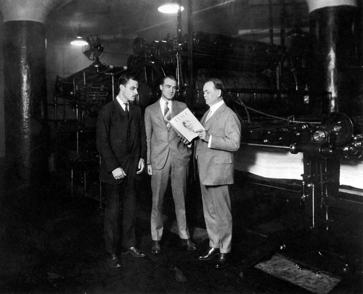 TIME co-founders Briton Hadden (left) and Henry Luce (center) with politician and Cleveland city manager William R. Hopkins, in Cleveland on Aug. 31, 1925