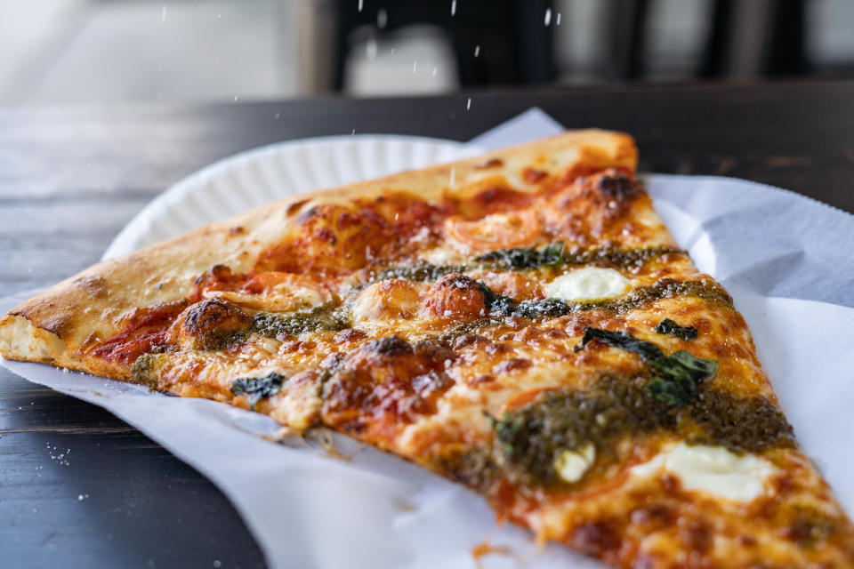 Pie.zaa's Sweet Caroline pizza, which features fresh mozzerella, marinara. ricotta, pesto, fresh basil, and a honey drizzle.
