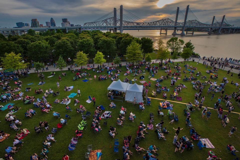 Spectators take seats in the grass during  the second Waterfront Wednesday of the year. May 29, 2019