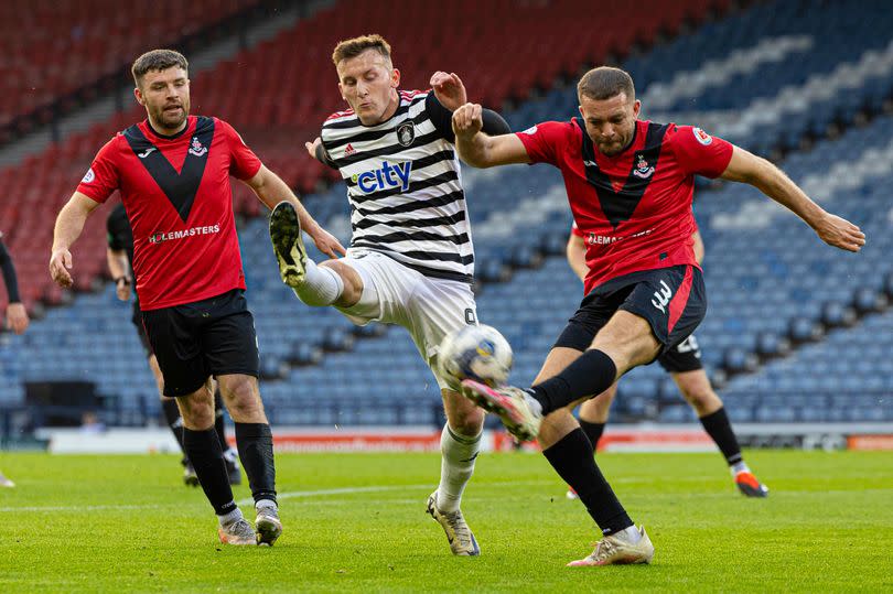 Airdrie's Aaron Taylor-Sinclair tackles Queen's Park's Ruari Paton as the sides clashed in the Championship at Hampden