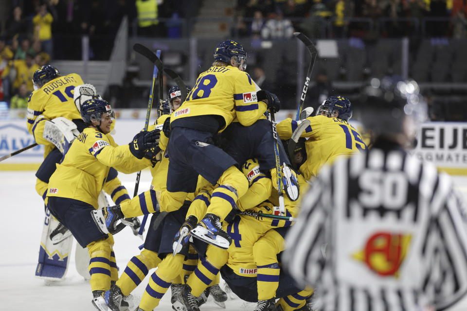 Sweden players celebrate winning during the IIHF World Junior Championship ice hockey quarterfinal match between Sweden and Switzerland at Scandinavium in Gothenburg, Sweden, Tuesday, Jan. 2, 2024. (Adam Ihse/TT News Agency via AP)