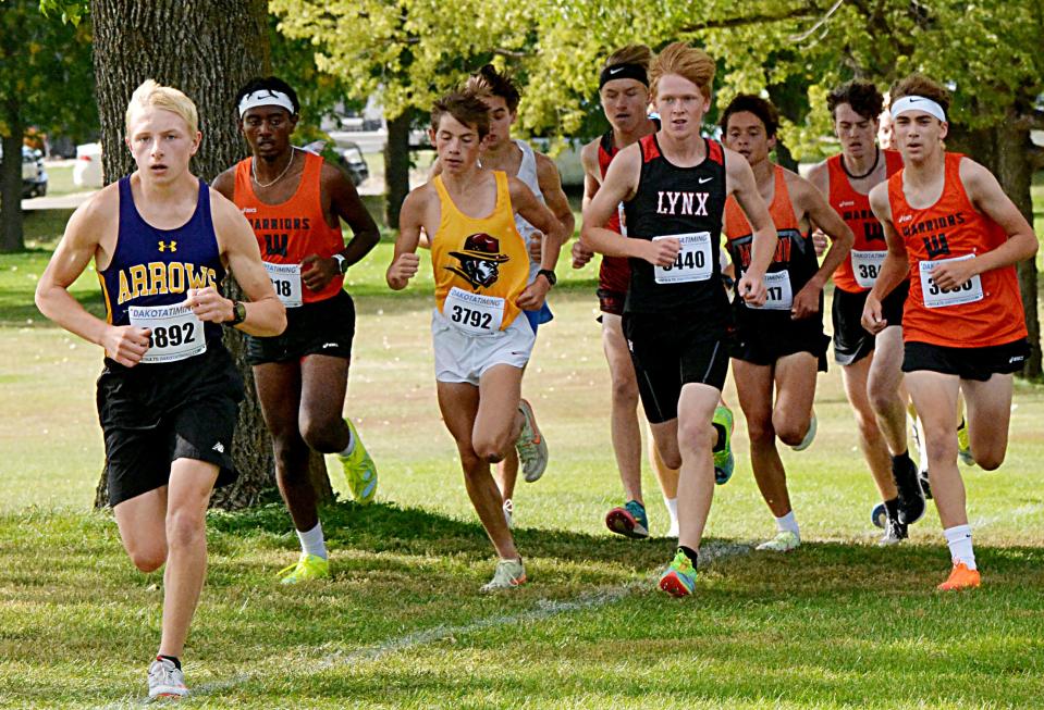 Watertown's Ty Sullivan leads a group of runners in the varsity boys' 5,000-meter race Thursday, Sept. 29, 2022 during the Watoma Invitational cross country meet at Cattail Crossing Golf Course.