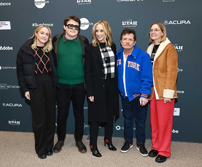 Michael J. Fox on a red carpet joined by his wife and three of his children