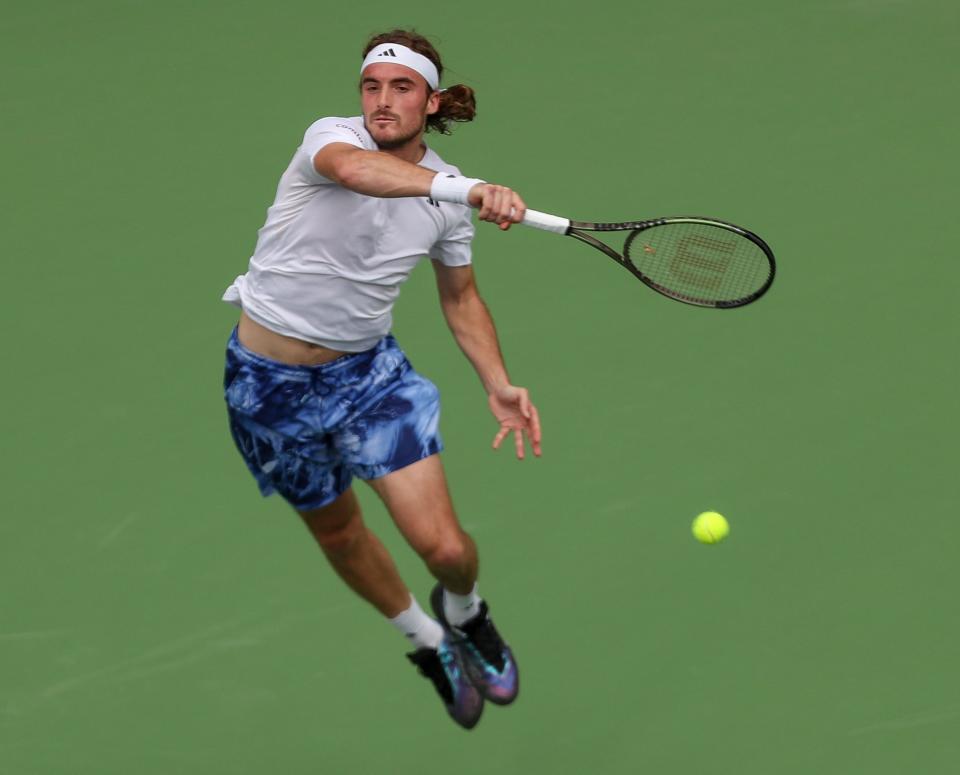 Stefanos Tsitipas hits a shot in his match against Jordan Thompson during the BNP Paribas Open in Indian Wells, Calif., March 10, 2023. 