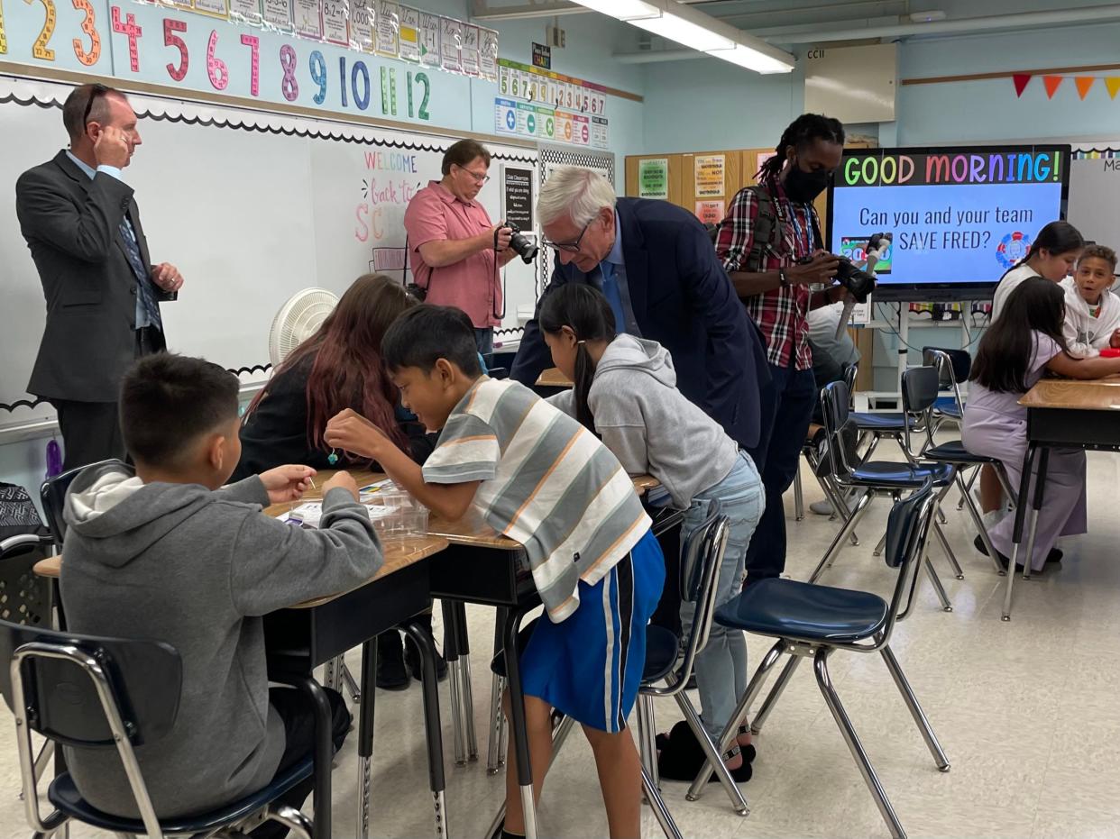 Gov. Tony Evers tours the Academy of Accelerated Learning, part of Milwaukee Public Schools, in 2022.