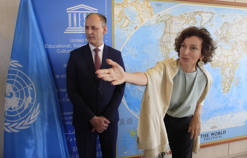 Iraq's Culture Minister Abdulamir al-Dafar Hamdani, left, is welcomed by UNESCO'S Director-General Audrey Azoulay at the UNESCO's headquarters in Paris, Wednesday, Sept. 11. 2019. Iraqi officials meet at the UN's cultural agency in Paris to discuss plans for an ambitious $100 million reconstruction of the Islamic State-ravaged city of Mosul. (AP Photo/Michel Euler) HAMDANI