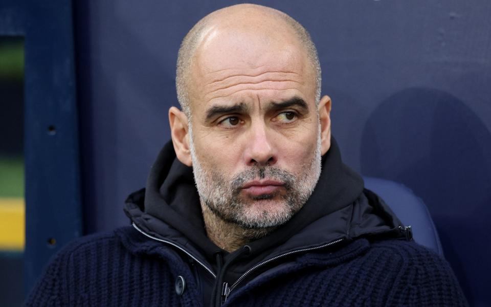 Pep Guardiola, Manager of Manchester City, looks on prior to the Premier League match between Manchester City and Aston Villa at Etihad Stadium on February 12, 2023 in Manchester, England - Clive Brunskill/Getty Images