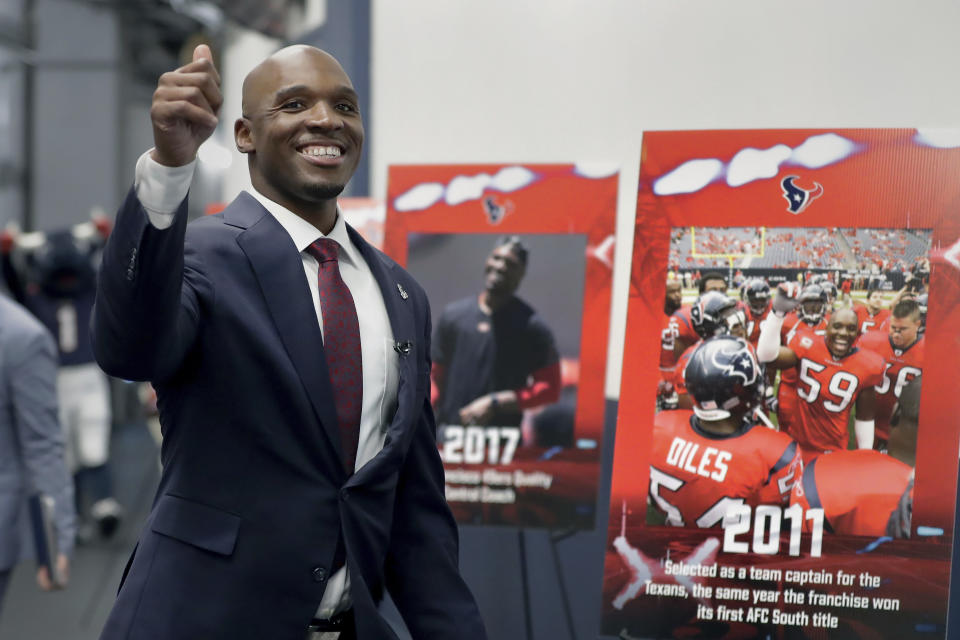 DeMeco Ryans gives a thumbs-up as he arrives at NRG Stadium in Houston for an NFL football news conference formally announcing him as the new head coach of the Houston Texans, Thursday, Feb. 2, 2023. (AP Photo/Michael Wyke)