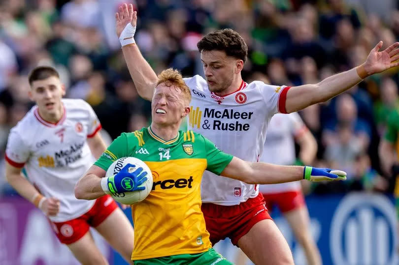 Donegal's Oisin Gallen with Tyrone's Michael McKernan