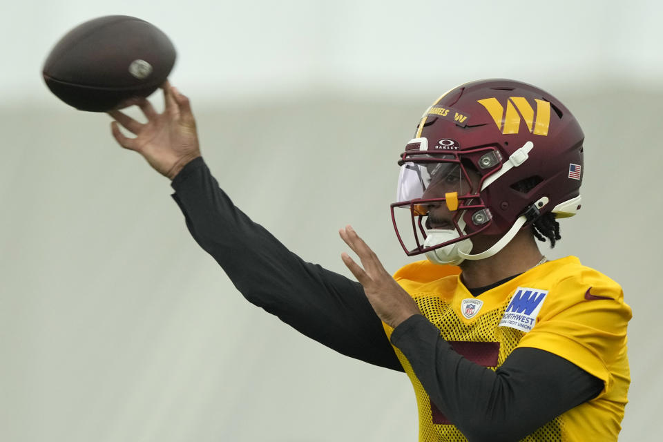 Washington Commanders first round draft pick quarterback Jayden Daniels warms up during an NFL rookie minicamp football practice in Ashburn, Va., Friday, May 10, 2024. (AP Photo/Susan Walsh)