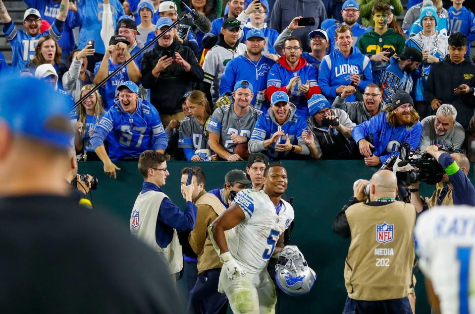 Detroit Lions fans cheer for running back David Montgomery as he heads to the locker room after a 34-20 win over the Green Bay Packers on Thursday, Sept. 28, 2023, at Lambeau Field in Green Bay, Wis. Montgomery scored three rushing TDs.