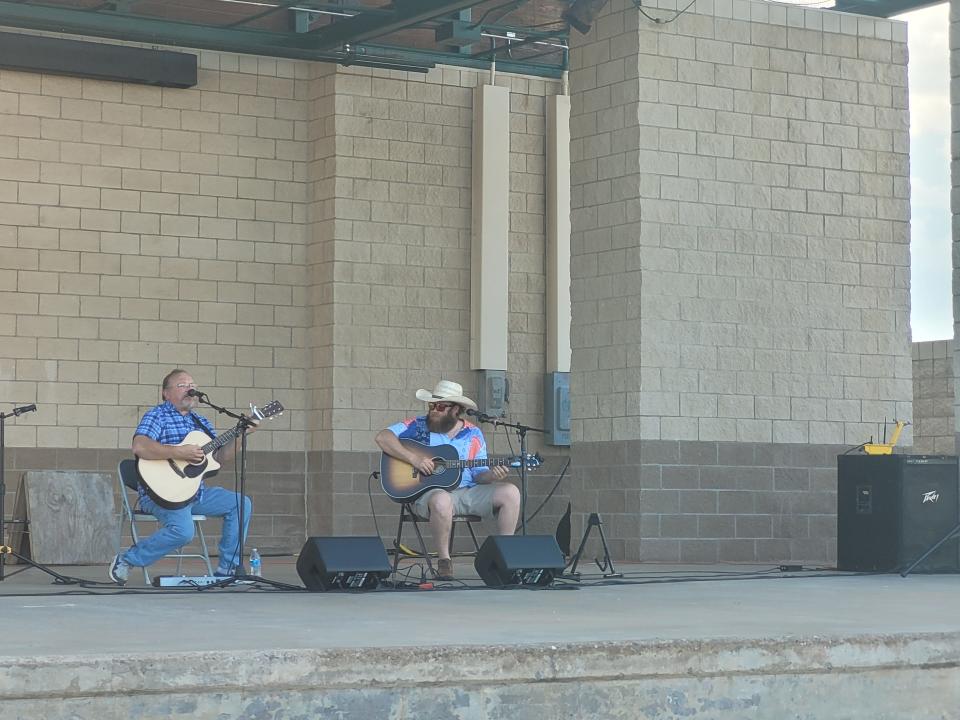 Bret James, right, performs on stage in Burkburnett.