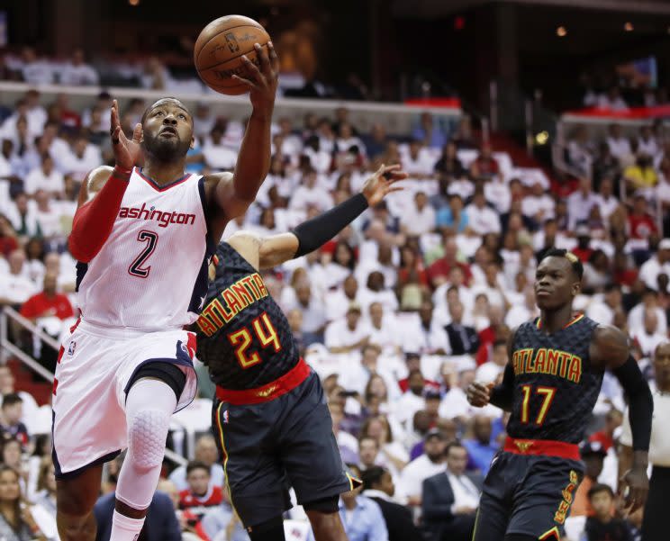 John Wall leaves the Hawks in his dust. (AP)