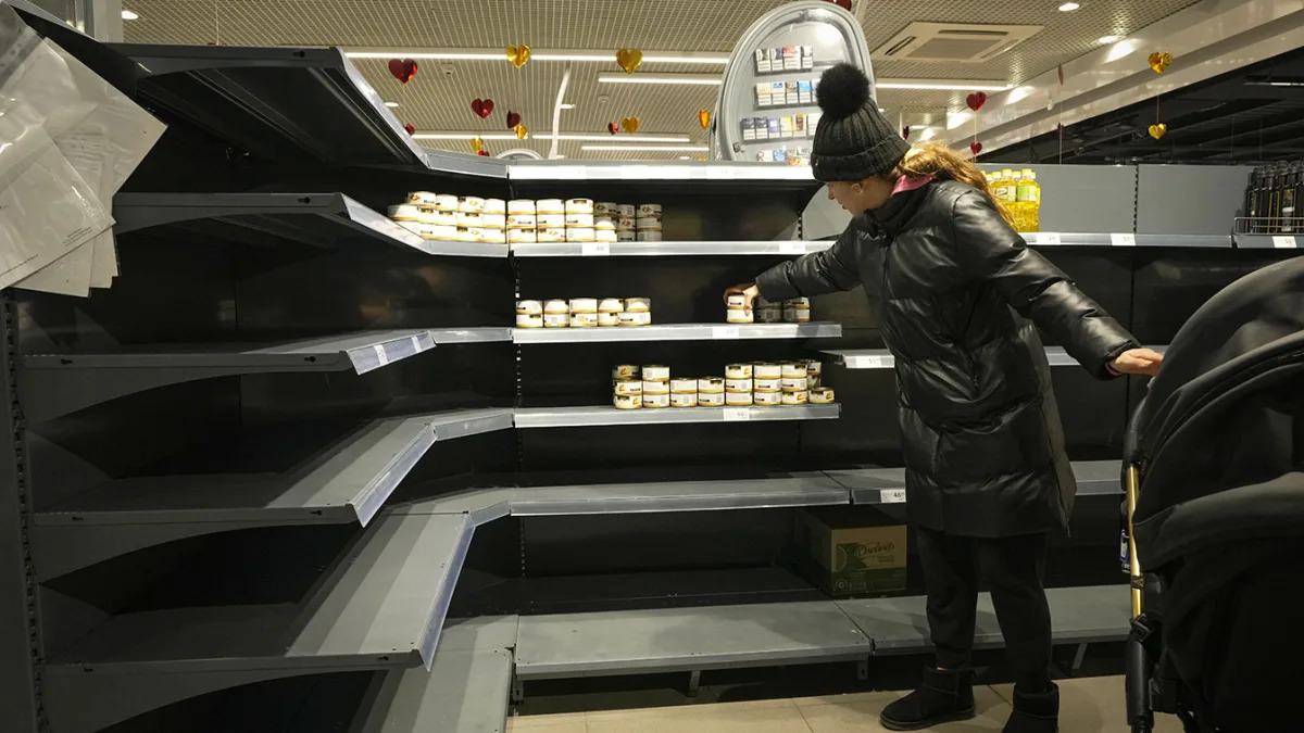 Photos: Long lines and empty shelves seen at supermarkets in Ukraine