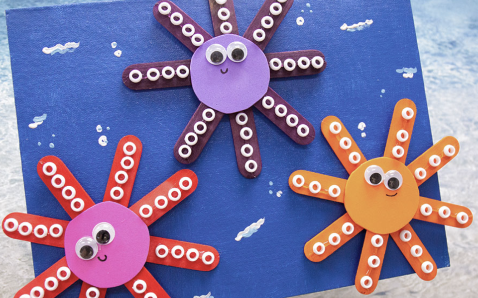 crafts for kids, craft stick octopus with googly eyes and smiley faces