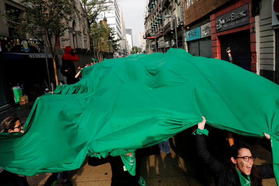 Activists, part of a movement known as "Marea Verde" take part in a performance to film a message to spread awareness during the International Safe Abortion Day in Mexico City, Mexico September 28, 2019. REUTERS/Carlos Jasso