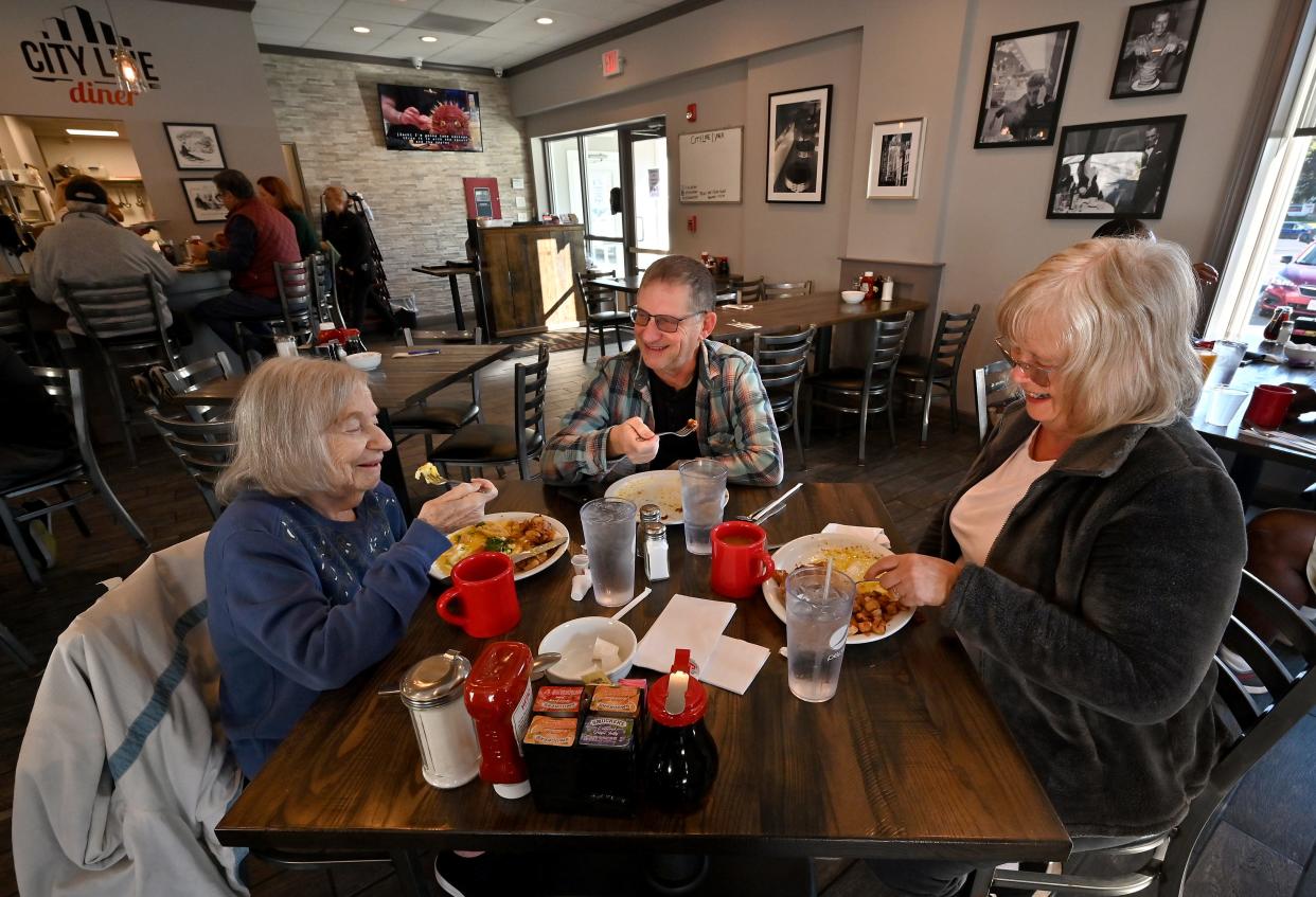 First-time City Line Diner patron Beatrice Cohen, 93, enjoys breakfast with her son and daughter-in-law, Mike and Carol Cohen.