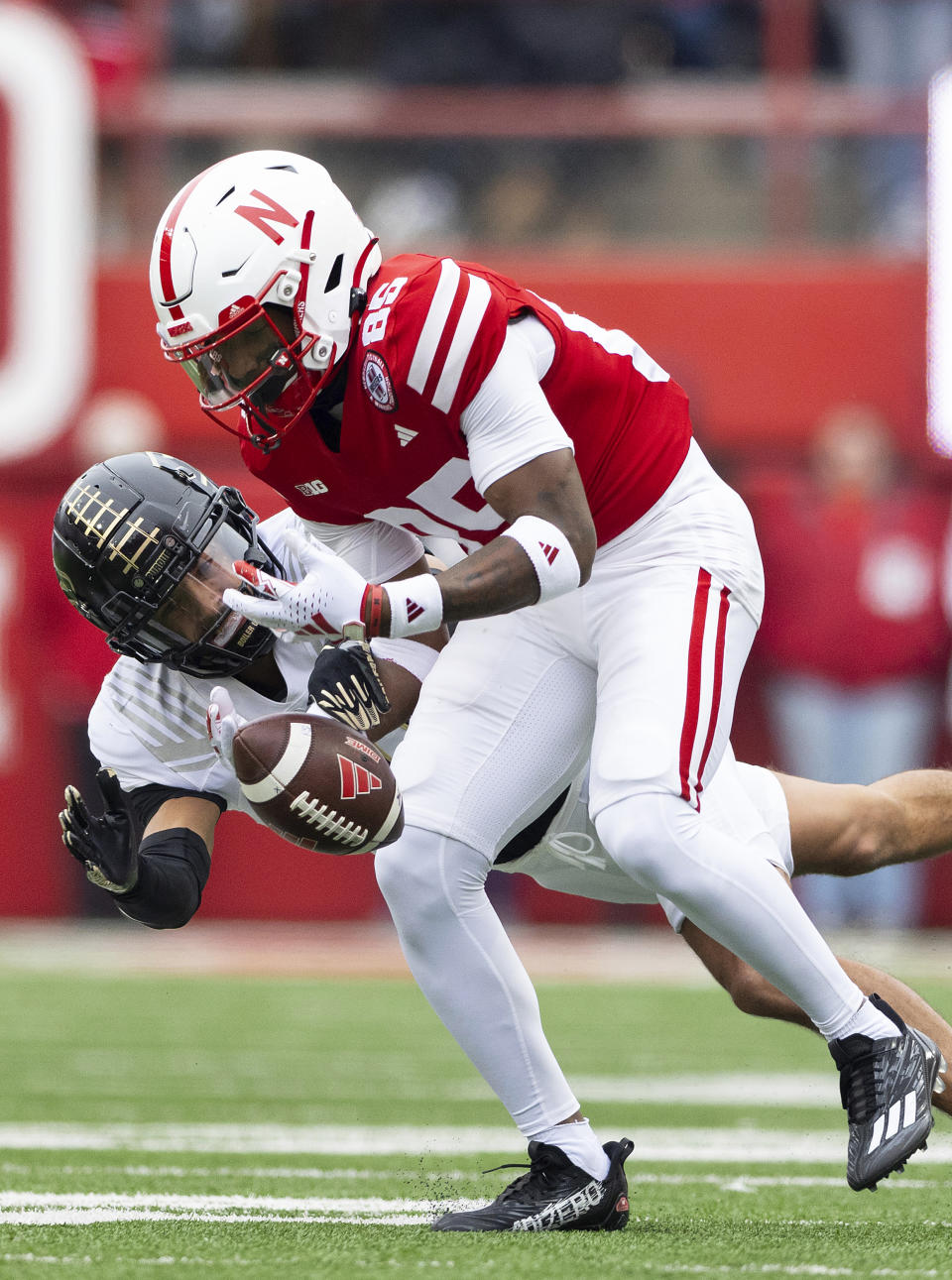 Purdue's Cam Allen, left, breaks up a pass intended for Nebraska's Jaidyn Doss, right, during the first half of an NCAA college football game Saturday, Oct. 28, 2023, in Lincoln, Neb. (AP Photo/Rebecca S. Gratz)