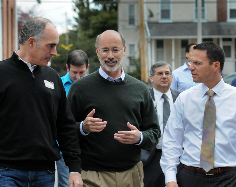 CORRECTS BYLINE TO  JOHN STRICKLER -Tom Wolf, center, talks with Pa. Senator Bob Casey, left and Josh Shapiro, chairman of Montgomery County commissioners Thursday, Oct. 30, 2014. Wolf is running for the office of governor of Pennsylvania and made a campaign stop at the Friendship Fire Company in Royersford, Pa., to speak with his supporters. (AP Photo/The Mercury, John Strickler)